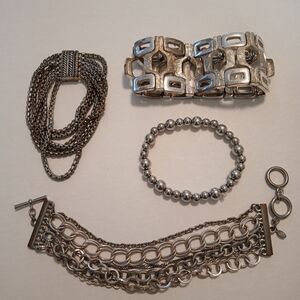 #411.  4 Piece Silver Toned Bracelet Bundle